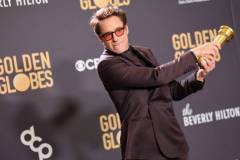 Robert Downey Jr. poses with the award for Best Performance by a Male Actor in a Supporting Role in any Motion Picture for "Oppenheimer" at the 81st Golden Globe Awards held at the Beverly Hilton Hotel on January 7, 2024 in Beverly Hills, California. (Photo by John Salangsang/Golden Globes 2024/Golden Globes 2024 via Getty Images)