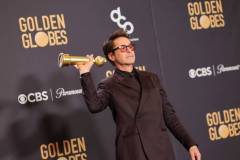 Robert Downey Jr. poses with the award for Best Performance by a Male Actor in a Supporting Role in any Motion Picture for "Oppenheimer" at the 81st Golden Globe Awards held at the Beverly Hilton Hotel on January 7, 2024 in Beverly Hills, California. (Photo by John Salangsang/Golden Globes 2024/Golden Globes 2024 via Getty Images)