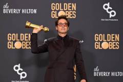 Robert Downey Jr. poses with the award for Best Performance by a Male Actor in a Supporting Role in any Motion Picture for his role in "Oppenheimer" at the 81st Golden Globe Awards held at the Beverly Hilton Hotel on January 7, 2024 in Beverly Hills, California. (Photo by Gilbert Flores/Golden Globes 2024/Golden Globes 2024 via Getty Images)