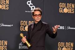 Robert Downey Jr. poses with the award for Best Performance by a Male Actor in a Supporting Role in any Motion Picture for his role in "Oppenheimer" at the 81st Golden Globe Awards held at the Beverly Hilton Hotel on January 7, 2024 in Beverly Hills, California. (Photo by Gilbert Flores/Golden Globes 2024/Golden Globes 2024 via Getty Images)