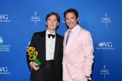 PALM SPRINGS, CALIFORNIA - JANUARY 04: (L-R) Cillian Murphy, winner of the Desert Palm Achievement Award for "Oppenheimer,"  and Robert Downey Jr. pose backstage during the 35th Annual Palm Springs International Film Awards, Sponsored by IHG Hotels & Resorts, at Palm Springs Convention Center on January 04, 2024 in Palm Springs, California. (Photo by Amy Sussman/Getty Images for IHG Hotels & Resorts)