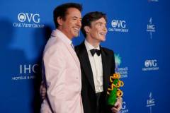 PALM SPRINGS, CALIFORNIA - JANUARY 04: (L-R) Robert Downey Jr. and Cillian Murphy, winner of the Desert Palm Achievement Award for "Oppenheimer," speak backstage during the 35th Annual Palm Springs International Film Awards at Palm Springs Convention Center on January 04, 2024 in Palm Springs, California. (Photo by Presley Ann/Getty Images for Palm Springs International Film Society)