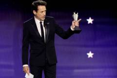 SANTA MONICA, CALIFORNIA - JANUARY 14: Robert Downey Jr. accepts the Best Supporting Actor Award for 'Oppenheimer' onstage during the 29th Annual Critics Choice Awards at Barker Hangar on January 14, 2024 in Santa Monica, California. (Photo by Kevin Winter/Getty Images for Critics Choice Association)
