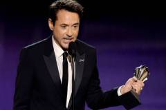 SANTA MONICA, CALIFORNIA - JANUARY 14: Robert Downey Jr. accepts the Best Supporting Actor Award for 'Oppenheimer' onstage during the 29th Annual Critics Choice Awards at Barker Hangar on January 14, 2024 in Santa Monica, California. (Photo by Kevin Winter/Getty Images for Critics Choice Association)