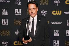 SANTA MONICA, CALIFORNIA - JANUARY 14: Robert Downey Jr., winner of the Best Supporting Actor Award for 'Oppenheimer,' poses in the press room during the 29th Annual Critics Choice Awards at Barker Hangar on January 14, 2024 in Santa Monica, California. (Photo by Kevin Mazur/Getty Images for Critics Choice Association)