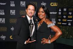 SANTA MONICA, CALIFORNIA - JANUARY 14: (L-R) Robert Downey Jr., winner of the Best Supporting Actor Award for 'Oppenheimer,' and Angela Bassett pose in the press room during the 29th Annual Critics Choice Awards at Barker Hangar on January 14, 2024 in Santa Monica, California. (Photo by Kevin Mazur/Getty Images for Critics Choice Association)