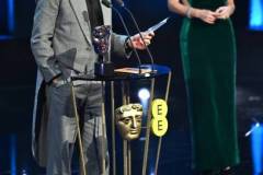 LONDON, ENGLAND - FEBRUARY 18: Robert Downey Jr. accepts the Supporting Actor Award for 'Oppenheimer' on stage during the EE BAFTA Film Awards 2024 at The Royal Festival Hall on February 18, 2024 in London, England. (Photo by Joe Maher/BAFTA/Getty Images for BAFTA)