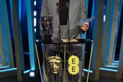 LONDON, ENGLAND - FEBRUARY 18: Robert Downey Jr. accepts the Supporting Actor Award for 'Oppenheimer' on stage during the EE BAFTA Film Awards 2024 at The Royal Festival Hall on February 18, 2024 in London, England. (Photo by Kate Green/BAFTA/Getty Images for BAFTA)