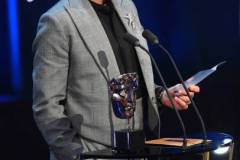 LONDON, ENGLAND - FEBRUARY 18: Robert Downey Jr. accepts the Supporting Actor Award for 'Oppenheimer' on stage during the EE BAFTA Film Awards 2024 at The Royal Festival Hall on February 18, 2024 in London, England. (Photo by Joe Maher/BAFTA/Getty Images for BAFTA)