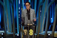 LONDON, ENGLAND - FEBRUARY 18: Robert Downey Jr. accepts the Supporting Actor Award for 'Oppenheimer' on stage during the EE BAFTA Film Awards 2024 at The Royal Festival Hall on February 18, 2024 in London, England. (Photo by Kate Green/BAFTA/Getty Images for BAFTA)