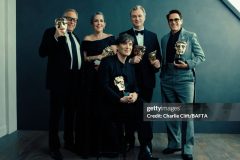 LONDON, ENGLAND - FEBRUARY 18:  (L-R) Charles Roven, Emma Thomas, Cillian Murphy, Christopher Nolan and Robert Downey Jr. are photographed backstage with their awards for the film Oppenheimer at the 2024 EE BAFTA Film Awards, held at The Royal Festival Hall on February 18, 2024 in London, England. (Photo by Charlie Clift/BAFTA/Contour by Getty Images)