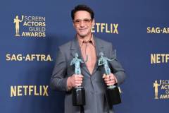 Robert Downey Jr. poses the awards for Outstanding Performance by a Male Actor in a Leading Role in a Motion Picture and Outstanding Performance by a Cast in a Motion Picture for "Oppenheimer" at the 30th Annual Screen Actors Guild Awards held at the Shrine Auditorium and Expo Hall on February 24, 2024 in Los Angeles, California. (Photo by Gilbert Flores/Variety via Getty Images)