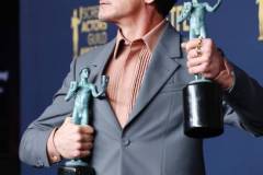 LOS ANGELES, CALIFORNIA - FEBRUARY 24: Robert Downey Jr., winner of the Outstanding Performance by a Male Actor in a Supporting Role award and the Outstanding Performance by a Cast in a Motion Picture award for 'Oppenheimer' poses in the press room during the 30th Annual Screen Actors Guild Awards at Shrine Auditorium and Expo Hall on February 24, 2024 in Los Angeles, California. (Photo by Amy Sussman/WireImage)