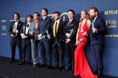 LOS ANGELES, CALIFORNIA - FEBRUARY 24: (L-R) Benny Safdie, Cillian Murphy, Robert Downey Jr., Josh Hartnett, Alden Ehrenreich, Casey Affleck, Emily Blunt and Kenneth Branagh, winner of the Outstanding Performance by a Cast in a Motion Picture award for 'Oppenheimer' pose in the press room during the 30th Annual Screen Actors Guild Awards at Shrine Auditorium and Expo Hall on February 24, 2024 in Los Angeles, California. (Photo by Amy Sussman/WireImage)