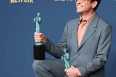 LOS ANGELES, CALIFORNIA - FEBRUARY 24: Robert Downey Jr., winner of the Outstanding Performance by a Male Actor in a Supporting Role award and the Outstanding Performance by a Cast in a Motion Picture award for 'Oppenheimer' poses in the press room during the 30th Annual Screen Actors Guild Awards at Shrine Auditorium and Expo Hall on February 24, 2024 in Los Angeles, California.  (Photo by Monica Schipper/FilmMagic)