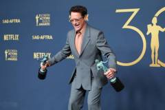 LOS ANGELES, CALIFORNIA - FEBRUARY 24: Robert Downey Jr., winner of the Outstanding Performance by a Male Actor in a Supporting Role award and the Outstanding Performance by a Cast in a Motion Picture award for 'Oppenheimer' poses in the press room during the 30th Annual Screen Actors Guild Awards at Shrine Auditorium and Expo Hall on February 24, 2024 in Los Angeles, California.  (Photo by Monica Schipper/FilmMagic)