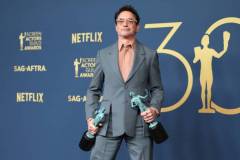 LOS ANGELES, CALIFORNIA - FEBRUARY 24: Robert Downey Jr., winner of the Outstanding Performance by a Male Actor in a Supporting Role award and the Outstanding Performance by a Cast in a Motion Picture award for 'Oppenheimer' poses in the press room during the 30th Annual Screen Actors Guild Awards at Shrine Auditorium and Expo Hall on February 24, 2024 in Los Angeles, California.  (Photo by Monica Schipper/FilmMagic)