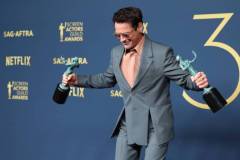 LOS ANGELES, CALIFORNIA - FEBRUARY 24: Robert Downey Jr., winner of the Outstanding Performance by a Male Actor in a Supporting Role award and the Outstanding Performance by a Cast in a Motion Picture award for 'Oppenheimer' poses in the press room during the 30th Annual Screen Actors Guild Awards at Shrine Auditorium and Expo Hall on February 24, 2024 in Los Angeles, California.  (Photo by Monica Schipper/FilmMagic)