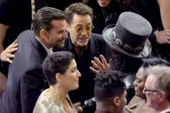 HOLLYWOOD, CALIFORNIA - MARCH 10: (L-R) Bradley Cooper, Robert Downey Jr., and Slash in the audience during the 96th Annual Academy Awards at Dolby Theatre on March 10, 2024 in Hollywood, California. (Photo by Kevin Winter/Getty Images)