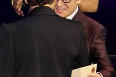 HOLLYWOOD, CALIFORNIA - MARCH 10: (L-R) Robert Downey Jr. accepts the Best Actor in a Supporting Role for "Oppenheimer" from Ke Huy Quan onstage during the 96th Annual Academy Awards at Dolby Theatre on March 10, 2024 in Hollywood, California. (Photo by Kevin Winter/Getty Images)