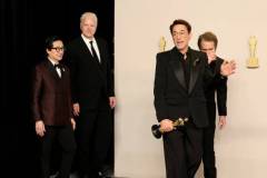 HOLLYWOOD, CALIFORNIA - MARCH 10: (L-R) Ke Huy Quan, Tim Robbins, Robert Downey Jr., winner of the Best Actor in a Supporting Role award for ?Oppenheimer?, and Sam Rockwell pose in the press room during the 96th Annual Academy Awards at Ovation Hollywood on March 10, 2024 in Hollywood, California. (Photo by Arturo Holmes/Getty Images)
