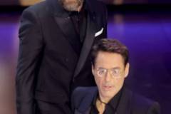 HOLLYWOOD, CALIFORNIA - MARCH 10: (L-R) Sam Rockwell presents the Best Actor in a Supporting Role award for "Oppenheimer" to Robert Downey Jr. onstage during the 96th Annual Academy Awards at Dolby Theatre on March 10, 2024 in Hollywood, California. (Photo by Kevin Winter/Getty Images)