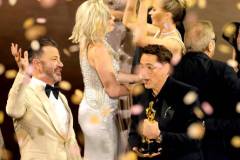 HOLLYWOOD, CALIFORNIA - MARCH 10: Robert Downey Jr. (R) accepts the Best Picture award for "Oppenheimer" onstage during the 96th Annual Academy Awards at Dolby Theatre on March 10, 2024 in Hollywood, California. (Photo by Kevin Winter/Getty Images)