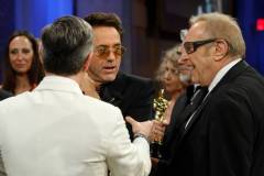 HOLLYWOOD, CALIFORNIA - MARCH 10: (3L) Robert Downey Jr., winner of the Best Actor in a Supporting Role and Producer, Charles Roven (R), winner of the Best Picture award for 'Oppenheimer,' attend the Governors Ball during the 96th Annual Academy Awards at Dolby Theatre on March 10, 2024 in Hollywood, California. (Photo by Mike Coppola/Getty Images)