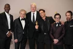 HOLLYWOOD, CALIFORNIA - MARCH 10: (L-R) Mahershala Ali, Christoph Waltz, Tim Robbins, Robert Downey Jr., winner of the Best Actor in a Supporting Role award for ?Oppenheimer?, Ke Huy Quan, and Sam Rockwell onstage in the press room at the 96th Annual Academy Awards at Ovation Hollywood on March 10, 2024 in Hollywood, California. (Photo by Jeff Kravitz/FilmMagic)