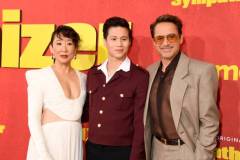 LOS ANGELES, CALIFORNIA - APRIL 09: (L-R) Sandra Oh, Hoa Xuande, and Robert Downey Jr. attend HBO's "The Sympathizer" Red Carpet Premiere Event at Paramount Theater on April 09, 2024 in Los Angeles, California.  (Photo by FilmMagic/FilmMagic for HBO)