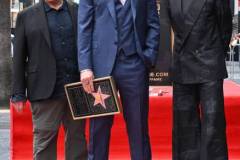 George Miller, Chris Hemsworth and Robert Downey Jr. during the ceremony honoring Chris Hemsworth with a Star on the Hollywood Walk of Fame on May 23, 2024 in Los Angeles, California. (Photo by Gilbert Flores/Variety via Getty Images)