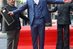 George Miller, Chris Hemsworth and Robert Downey Jr. during the ceremony honoring Chris Hemsworth with a Star on the Hollywood Walk of Fame on May 23, 2024 in Los Angeles, California. (Photo by Gilbert Flores/Variety via Getty Images)