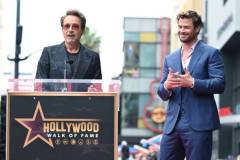 Robert Downey Jr. and Chris Hemsworth during the ceremony honoring Chris Hemsworth with a Star on the Hollywood Walk of Fame on May 23, 2024 in Los Angeles, California. (Photo by Gilbert Flores/Variety via Getty Images)