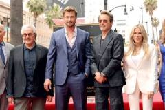HOLLYWOOD, CALIFORNIA - MAY 23: (L-R) George Miller, Chris Hemsworth, Robert Downey Jr. and Ellen K attend the Hollywood Walk of Fame Star Ceremony honoring Chris Hemsworth on May 23, 2024 in Hollywood, California. (Photo by Kevin Winter/Getty Images)