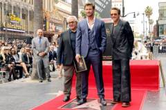 HOLLYWOOD, CALIFORNIA - MAY 23: (L-R) George Miller, Chris Hemsworth, Robert Downey Jr. attend the Hollywood Walk of Fame Star Ceremony honoring Chris Hemsworth on May 23, 2024 in Hollywood, California. (Photo by Kevin Winter/Getty Images)
