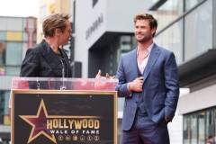 HOLLYWOOD, CALIFORNIA - MAY 23: Robert Downey Jr. (L) and Chris Hemsworth seen at the ceremony honoring Chris Hemsworth with a Star on the Hollywood Walk of Fame on May 23, 2024 in Hollywood, California. (Photo by Eric Charbonneau/Getty Images for Warner Bros.)