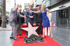 HOLLYWOOD, CALIFORNIA - MAY 23: (L-R) George Miller, Chris Hemsworth and Robert Downey Jr. seen at the ceremony honoring Chris Hemsworth with a Star on the Hollywood Walk of Fame on May 23, 2024 in Hollywood, California. (Photo by Eric Charbonneau/Getty Images for Warner Bros.)