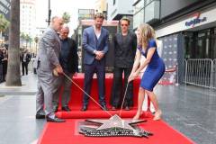 HOLLYWOOD, CALIFORNIA - MAY 23: (L-R) George Miller, Chris Hemsworth and Robert Downey Jr. seen at the ceremony honoring Chris Hemsworth with a Star on the Hollywood Walk of Fame on May 23, 2024 in Hollywood, California. (Photo by Eric Charbonneau/Getty Images for Warner Bros.)