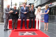 HOLLYWOOD, CALIFORNIA - MAY 23: (L-R) George Miller, Chris Hemsworth and Robert Downey Jr. seen at the ceremony honoring Chris Hemsworth with a Star on the Hollywood Walk of Fame on May 23, 2024 in Hollywood, California. (Photo by Eric Charbonneau/Getty Images for Warner Bros.)