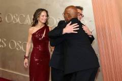 HOLLYWOOD, CALIFORNIA - MARCH 02: (L-R) Susan Downey, Robert Downey Jr., and Samuel L. Jackson  attend the 97th Annual Oscars at Dolby Theatre on March 02, 2025 in Hollywood, California. (Photo by Arturo Holmes/WireImage)