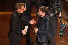 HOLLYWOOD, CALIFORNIA - MARCH 02: (L-R) Robert Downey Jr. presents Kieran Culkin?with the Best Actor In A Supporting Role award for "A Real Pain" onstage during the 97th Annual Oscars at Dolby Theatre on March 02, 2025 in Hollywood, California.  (Photo by Kevin Winter/Getty Images)