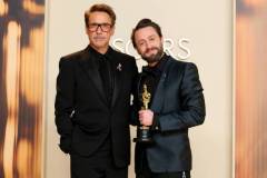 HOLLYWOOD, CALIFORNIA - MARCH 02: (L-R) Robert Downey Jr. and Kieran Culkin, winner of the Actor in a Supporting Role award for ?A Real Pain?, poses in the press room during the 97th Annual Oscars at Ovation Hollywood on March 02, 2025 in Hollywood, California. (Photo by Arturo Holmes/WireImage)