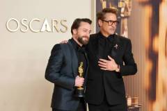 HOLLYWOOD, CALIFORNIA - MARCH 02: Kieran Culkin (L), winner of the Best Actor In A Supporting Role for ?A Real Pain?, and Robert Downey Jr. (R) pose in the press room during the 97th Annual Oscars at Ovation Hollywood on March 02, 2025 in Hollywood, California. (Photo by Mike Coppola/Getty Images)