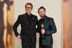 HOLLYWOOD, CALIFORNIA - MARCH 02: Kieran Culkin (R), winner of the Best Actor In A Supporting Role for ?A Real Pain?, and Robert Downey Jr. (L) pose in the press room during the 97th Annual Oscars at Ovation Hollywood on March 02, 2025 in Hollywood, California. (Photo by Mike Coppola/Getty Images)