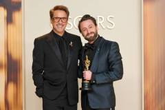 HOLLYWOOD, CALIFORNIA - MARCH 02: Kieran Culkin (R), winner of the Best Actor In A Supporting Role for ?A Real Pain?, and Robert Downey Jr. (L) pose in the press room during the 97th Annual Oscars at Ovation Hollywood on March 02, 2025 in Hollywood, California. (Photo by Mike Coppola/Getty Images)