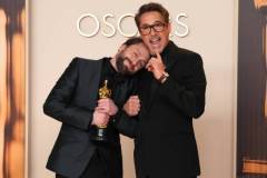HOLLYWOOD, CALIFORNIA - MARCH 02: (L-R) Kieran Culkin, winner of the Best Actor in a Supporting Role award for "A Real Pain,? and Robert Downey Jr. pose in the press room during the 97th Annual Oscars at Dolby Theatre on March 02, 2025 in Hollywood, California. (Photo by Jeff Kravitz/FilmMagic)