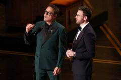 HOLLYWOOD, CALIFORNIA - MARCH 15: (L-R) Robert Downey Jr. and Chris Evans speak onstage during the 98th Oscars at Dolby Theatre on March 15, 2026 in Hollywood, California. (Photo by Kevin Winter/Getty Images)