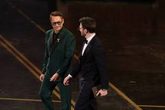 HOLLYWOOD, CALIFORNIA - MARCH 15: (L-R) Robert Downey Jr. and Chris Evans speak onstage during the 98th Oscars at Dolby Theatre on March 15, 2026 in Hollywood, California. (Photo by Kevin Winter/Getty Images)