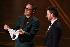 HOLLYWOOD, CALIFORNIA - MARCH 15: (L-R) Robert Downey Jr. and Chris Evans speak onstage during the 98th Oscars at Dolby Theatre on March 15, 2026 in Hollywood, California. (Photo by Kevin Winter/Getty Images)