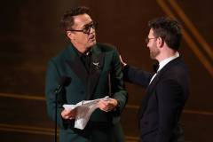 HOLLYWOOD, CALIFORNIA - MARCH 15: (L-R) Robert Downey Jr. and Chris Evans speak onstage during the 98th Oscars at Dolby Theatre on March 15, 2026 in Hollywood, California. (Photo by Kevin Winter/Getty Images)